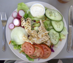 A nicely presented Cuban salad with grilled chicken